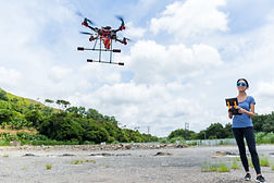 woman-controling-with-drone-GYBD25C.jpg
